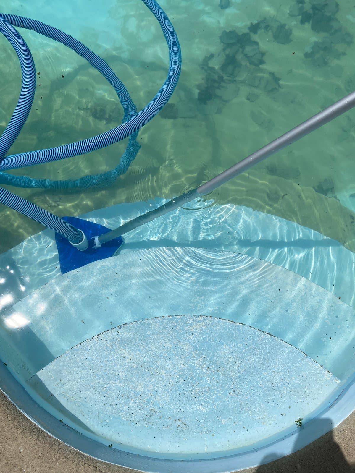 Vacuuming a pool during a deep cleanup