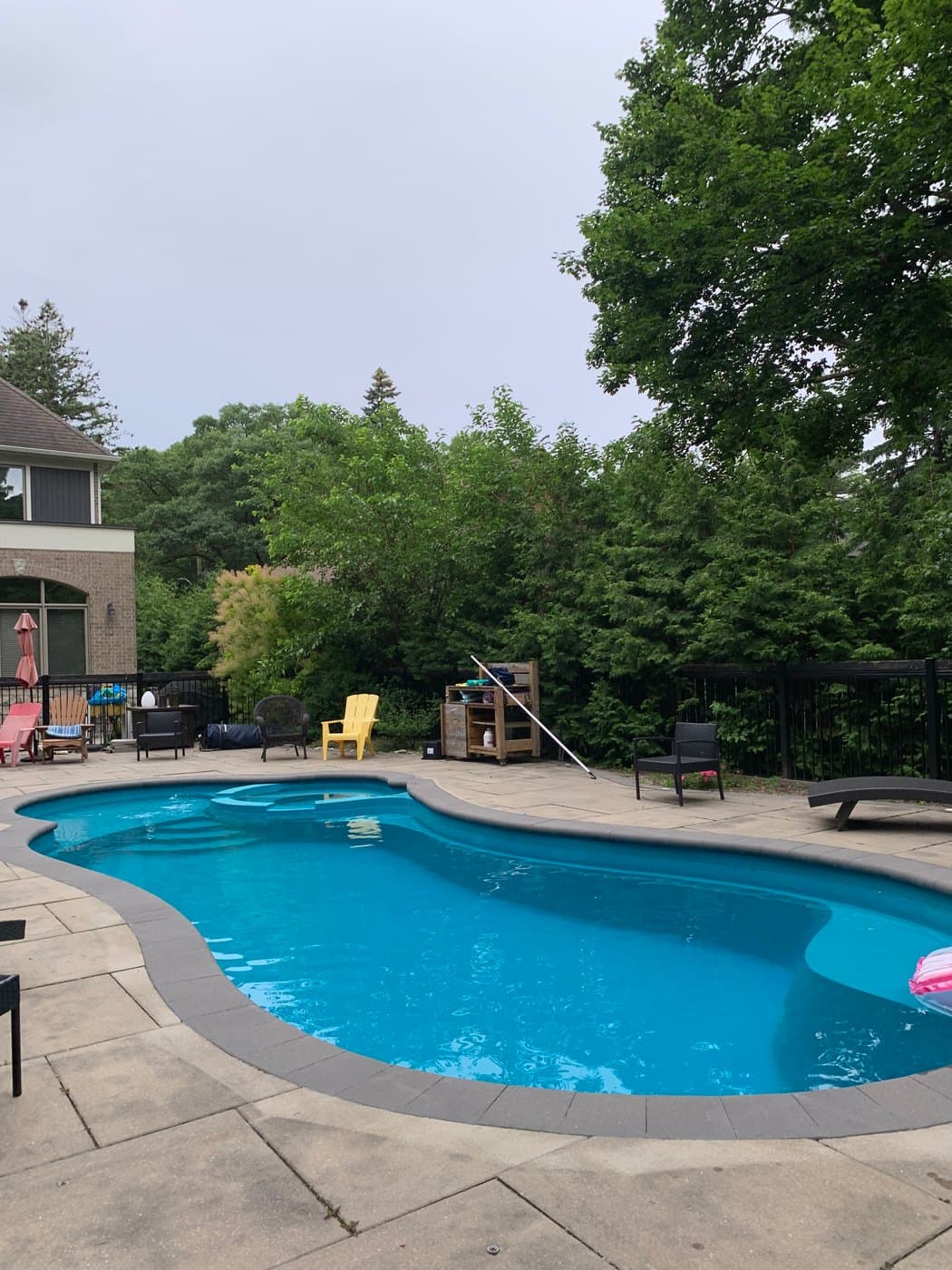 Freeform inground pool with stamped concrete patio